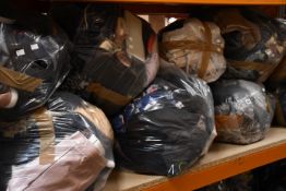 Nine bags of assorted clothing and related items.