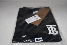 An as new Burberry Atherton long sleeved monogramed top in black (XXS - RRP £370).