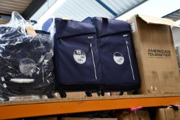 An American Tourister Litewing three-piece luggage set.