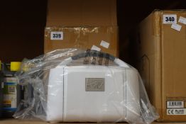 A boxed Stampin' Cut & Emboss machine.