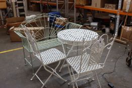 A green garden metal bench and white metal folding bistro garden set.