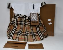 An as new Burberry baby's/little girl's Raglan Archive Check Dress (12M/80cm).