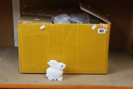 A box of Oriental stone rabbits.