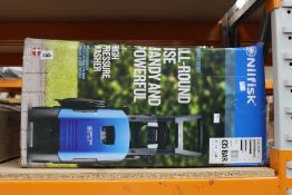 A boxed Nilfisk 135 compact home and car pressure washer.