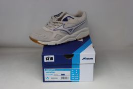 A pair of as new Mizuno Sky Medal trainers (UK 9).