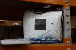 As new Marks & Spencer Trapunta throw (RRP £150), a pair of Marks & Spencer glow in the dark under