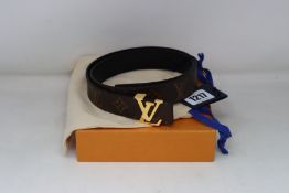 An as new Louis Vuitton black and brown reversible M9453x belt.