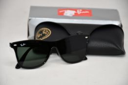 A pair of as new Ray Ban sunglasses.