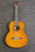 A boxed Yamaha C-40 classical guitar.