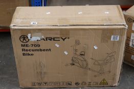 A boxed Marcy ME-709 recumbent exercise bike.