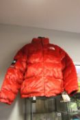 An as new The North Face Supreme red faux fur coat (XL - RRP €578).