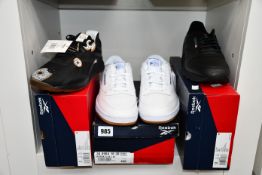 Four pairs of as new Reebok trainers; Classic Leather (UK 11), Nano X Unisex (UK 8) and two pairs of