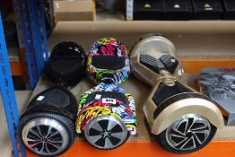 Three pre-owned hoverboards to include a SWAGTRON T5-U and a WINDGOO N1 (Bags and chargers not