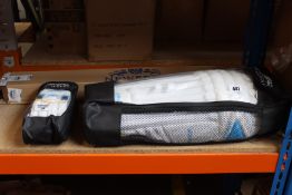 A pair of Newbery Invictus Batting leg guards (JRH) and Newbery Invictus Batting gloves (JRH)