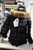 An as new Moncler coat (Size 5).