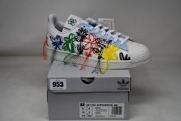 A pair of as new Adidas SST AEC Superearth SW trainers (UK 8).