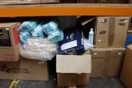 A shelf of cleaning products to include gloves and soaps.