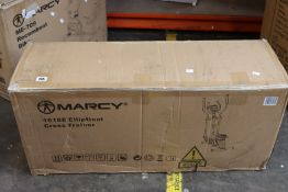 A boxed Marcy 1016E cross trainer.