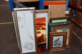 A quantity of prints/pictures/artwork/canvases.