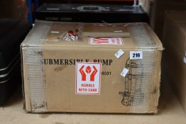 A boxed Audex Industrial dewatering submersible pump.