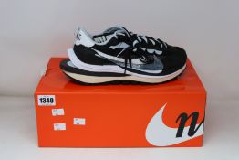 A pair of as new Nike Vaporwaffle/Sacai trainers (UK 7.5).