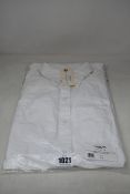 An as new Thom Browne classic long sleeve button down point collar shirt in white (Size 38).