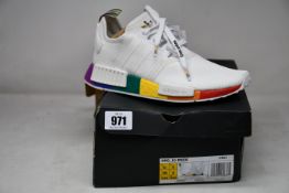 A pair of as new Adidas NMD_R1 Pride trainers (UK 6).