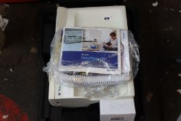 A pre-owned Baxter Homechoice Pro Claria with manuals and cables.