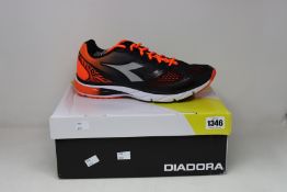 A pair of as new Diadora Mythos Blushield trainers (UK 10.5).