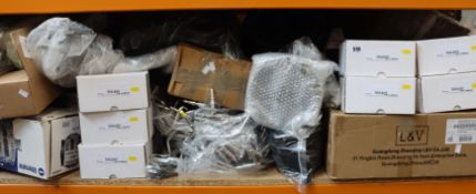 A shelf of car/motorbike parts and related items.