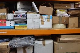 Two shelves of stationery/office equipment and supplies.