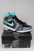 A pair of as new Nike Air Jordan 1 Mid (UK 13).