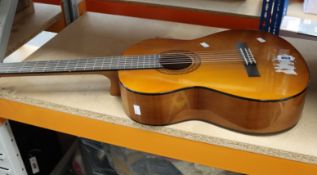 A Yamaha C40 classical guitar (Some slight damage).