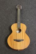 A boxed as new Faith FDNMG Nomad Mini Neptune electro acoustic guitar (Includes bag).