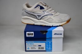 A pair of as new Mizuno Sky Medal trainers (UK 9).