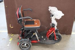 A small unbranded electric mobility scooter.