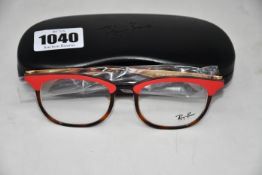 A pair of as new Ray Ban glasses frames with clear glass.