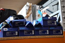 Six pairs of children's assorted as new Asics trainers.