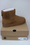 A pair of as new Ugg Classic Mini boots (UK 6).