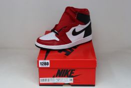 A pair of women's as new Nike Jordan 1 Retro High Satin Snake Chicago (UK 4).