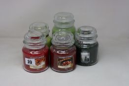 Five Yankee Candles to include crisp campfire apple, sparkling cinnamon, lime and coriander, vanilla