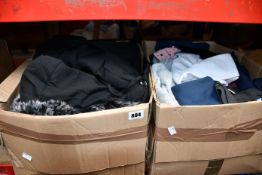 Two boxes of as new clothing and related items.