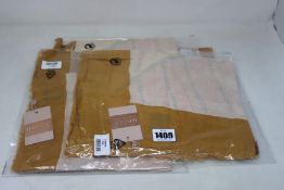 Four as new Unmade Copenhagen Imone scarves (RRP £45 each).