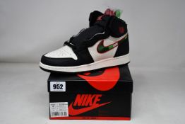 A pair of as new Nike Air Jordan Retro High OG GS (UK 6).