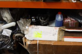 A shelf of car/motorbike parts and related items.