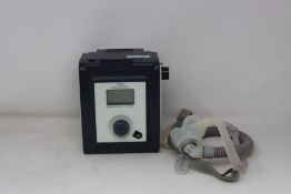 A System One by Philips Respironics Remstar Auto Flex CPAP machine with carry case.