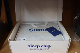 A boxed as new Sumo natural weighted blanket.