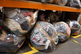 Eight bags of assorted clothing and related items.