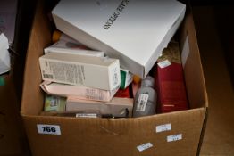 A box of assorted as new luxury beauty products.