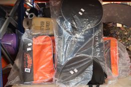 A Newberry Force Wheelie Cricket Bag in black and orange and a Newberry Coaching Bag in black.